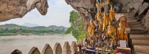 Buddha statues inside Pak Ou Caves overlooking Mekong River Laos
