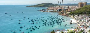 Phu Quoc coastline with fishing boats and cable car view over turquoise sea