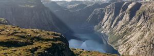 Dramatic cliffs and deep blue waters of Sognefjord Norway scenic fjord landscape
