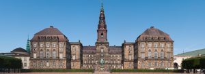 Christiansborg Palace in Copenhagen Denmark with central tower and historic architecture under clear blue sky