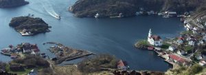 Aerial view of coastal village with church and islands in Norway