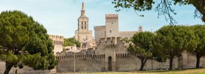 Palais des Papes Avignon with medieval fortress walls, towers, and historic architecture in southern France