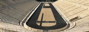 Panoramic view of the Panathenaic Stadium in Athens, showing marble seating tiers and the historic running track
