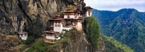Paro Taktsang Tiger’s Nest Monastery perched on cliff in Paro Bhutan with forested Himalayan landscape