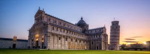 View of Pisa Cathedral and Leaning Tower of Pisa at sunset in Pisa
