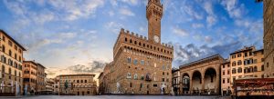 Historic Palazzo Vecchio in Piazza della Signoria at sunrise with Renaissance architecture and statues