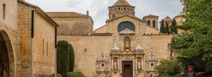 Entrance façade of Poblet Abbey, a historic Cistercian monastery with Romanesque and Gothic architecture