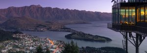 Queenstown skyline gondola restaurant overlooking Lake Wakatipu and mountain range at sunset New Zealand