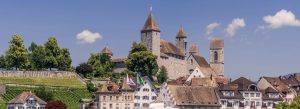 Rapperswil Castle overlooking Lake Zurich with historic town buildings and vineyards in Switzerland