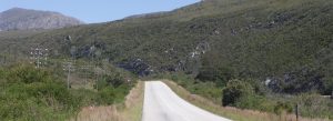 Scenic Route 62 road winding through green hills toward Oudtshoorn