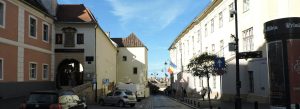 Street view near Casa Altemberger in Sibiu Old Town with historic buildings and Romanian flag, Transylvania, Romania
