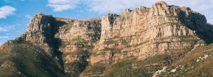 Table Mountain rocky cliffs and sandstone formations under a blue sky, scenic hiking landscape