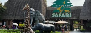 Entrance of Vinpearl Safari with animal sculptures including giraffe, elephant, and rhino at the wildlife park