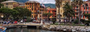 Colorful waterfront buildings and palm-lined promenade in Santa Margherita Ligure with harbor views and coastal charm