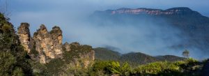 Three Sisters rock formation in Blue Mountains National Park with misty valley views, New South Wales Australia