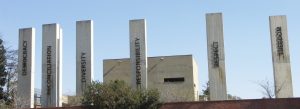 Concrete pillars displaying words like Democracy, Reconciliation, Diversity, Responsibility, Respect and Freedom at the Apartheid Museum in Johannesburg, South Africa.