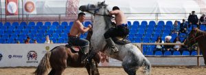 Traditional Atpen Audaryspak horseback wrestling competition during Kazakh national games festival