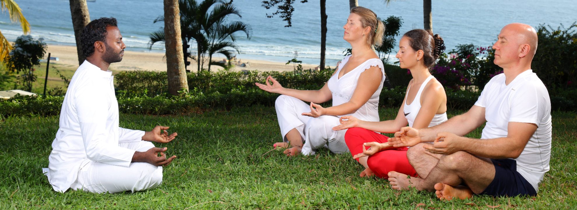 AyurSoma beachside meditation and yoga session with wellness instructor guiding travelers through mindfulness and holistic relaxation by the ocean.