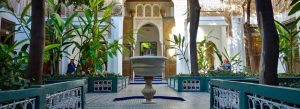 Traditional courtyard and intricate Moroccan architecture at Bahia Palace in Marrakech, Morocco
