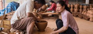 Local artisans crafting traditional pottery in Ban Chan Village near Luang Prabang