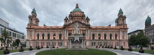 Belfast City Hall illuminated at dusk in Donegall Square, showcasing its iconic Baroque Revival architecture in Northern Ireland.