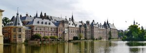 Historic Binnenhof government buildings reflected in the Hofvijver lake in The Hague, Netherlands