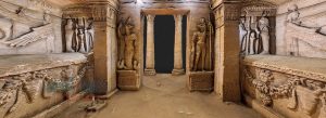Interior view of Catacombs of Kom el Shoqafa showing intricate Roman-Egyptian carvings in Alexandria, Egypt.