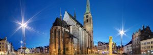 Cathedral of St. Bartholomew illuminated at night in the historic main square of Plzeň, Czech Republic.