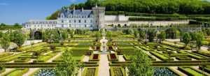 Beautiful view of Château de Villandry in France with its famous Renaissance gardens, geometric hedges, and elegant castle architecture under a clear blue sky.