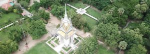 Aerial view of the memorial stupa at Choeung Ek Genocidal Center surrounded by lush greenery