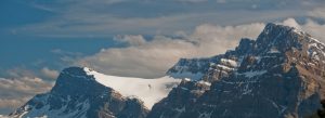 Crowfoot Glacier surrounded by rugged Rocky Mountain peaks in Banff National Park, Alberta, Canada