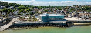 Aerial view of the D-Day Museum and coastline in Arromanches-les-Bains, Normandy, France.