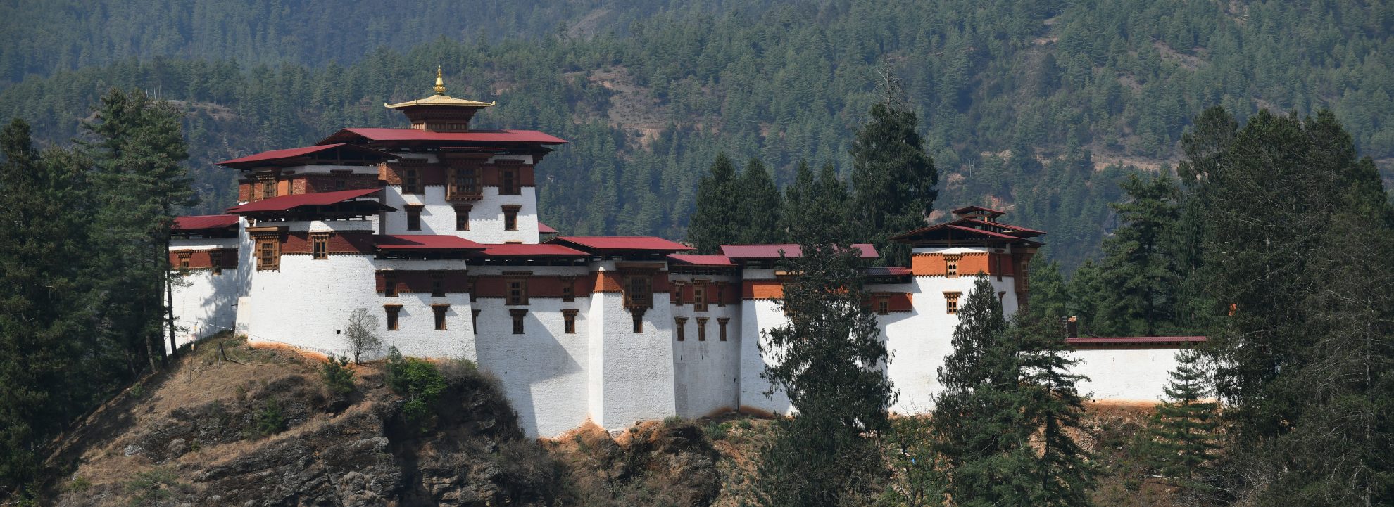 Drukgyel Dzong fortress in Paro, Bhutan surrounded by lush mountains