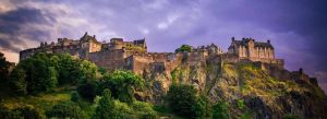 Edinburgh Castle perched on Castle Rock overlooking the historic city of Edinburgh, Scotland