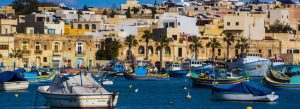 Colorful fishing boats at the harbour in Marsaxlokk fishing village, Malta