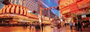 Bright neon lights and crowds at Fremont Street Experience in downtown Las Vegas, Nevada.