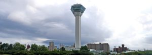 Goryokaku Tower overlooking Hakodate city and the historic star-shaped Goryokaku Fort in Hokkaido, Japan under dramatic cloudy skies.