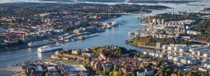 Aerial panoramic view of Gothenburg, Sweden, showcasing the harbor, bridges, waterfront districts, and surrounding islands.