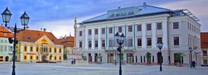 Historic square with elegant Baroque buildings in the city centre of Győr, Hungary.