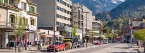Street view of Interlaken town with shops and mountain scenery in Switzerland