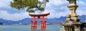Floating red torii gate of Itsukushima Shrine standing in the waters near Miyajima Island, Japan.
