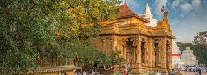Historic Kelaniya Raja Maha Viharaya Buddhist temple near Colombo, Sri Lanka, with traditional architecture and devotees.