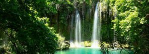 Kurşunlu Waterfall in Antalya, Turkey surrounded by lush green forest and turquoise water