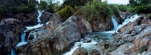 Flowing rapids and rocky cascades at Li Phi Falls in southern Laos