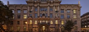 Front view of the historic Liszt Music Academy building illuminated at dusk in Budapest, Hungary.