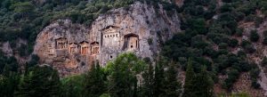 Ancient Lycian Rock Tombs carved into steep cliffs overlooking Dalyan in southwestern Turkey.