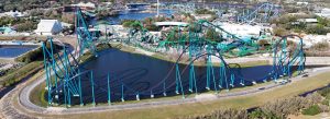 Aerial view of the Mako roller coaster at SeaWorld Orlando featuring steep drops and loops over water in Orlando, Florida.