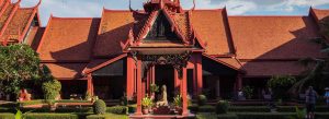 Front view of the National Museum of Cambodia in Phnom Penh featuring traditional Khmer architecture, red terracotta roofs, and landscaped gardens.