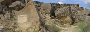 Entrance rock formations near Qobustan Museum and Gobustan archaeological reserve in Azerbaijan