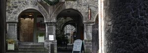Entrance arches and stone façade of Rothe House, a historic merchant townhouse in Kilkenny, Ireland.